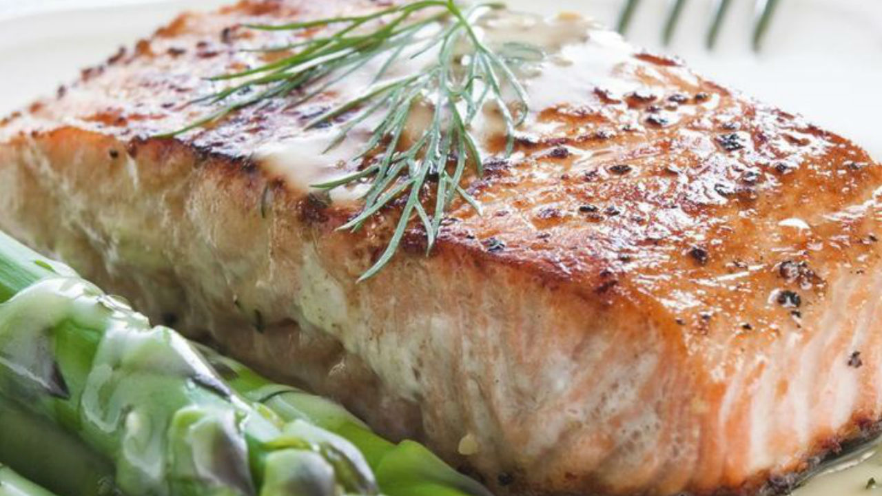 Roasted salmon with champ mash potatoes, asparagus and sauce vierge