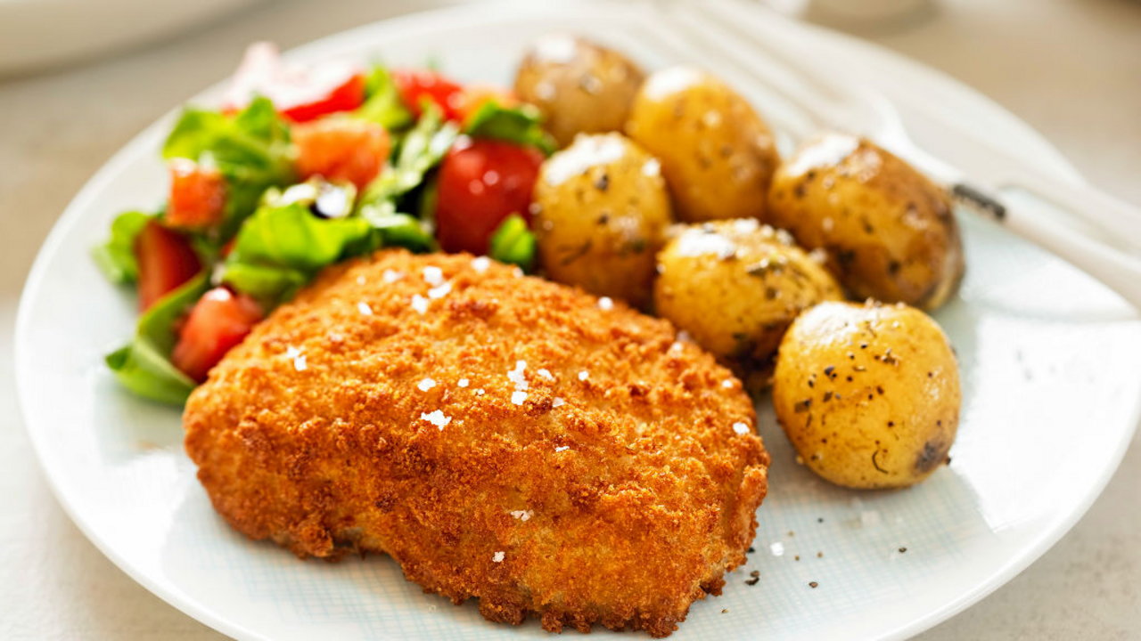 Pan fried fish with spicy potato salad and coconut sauce